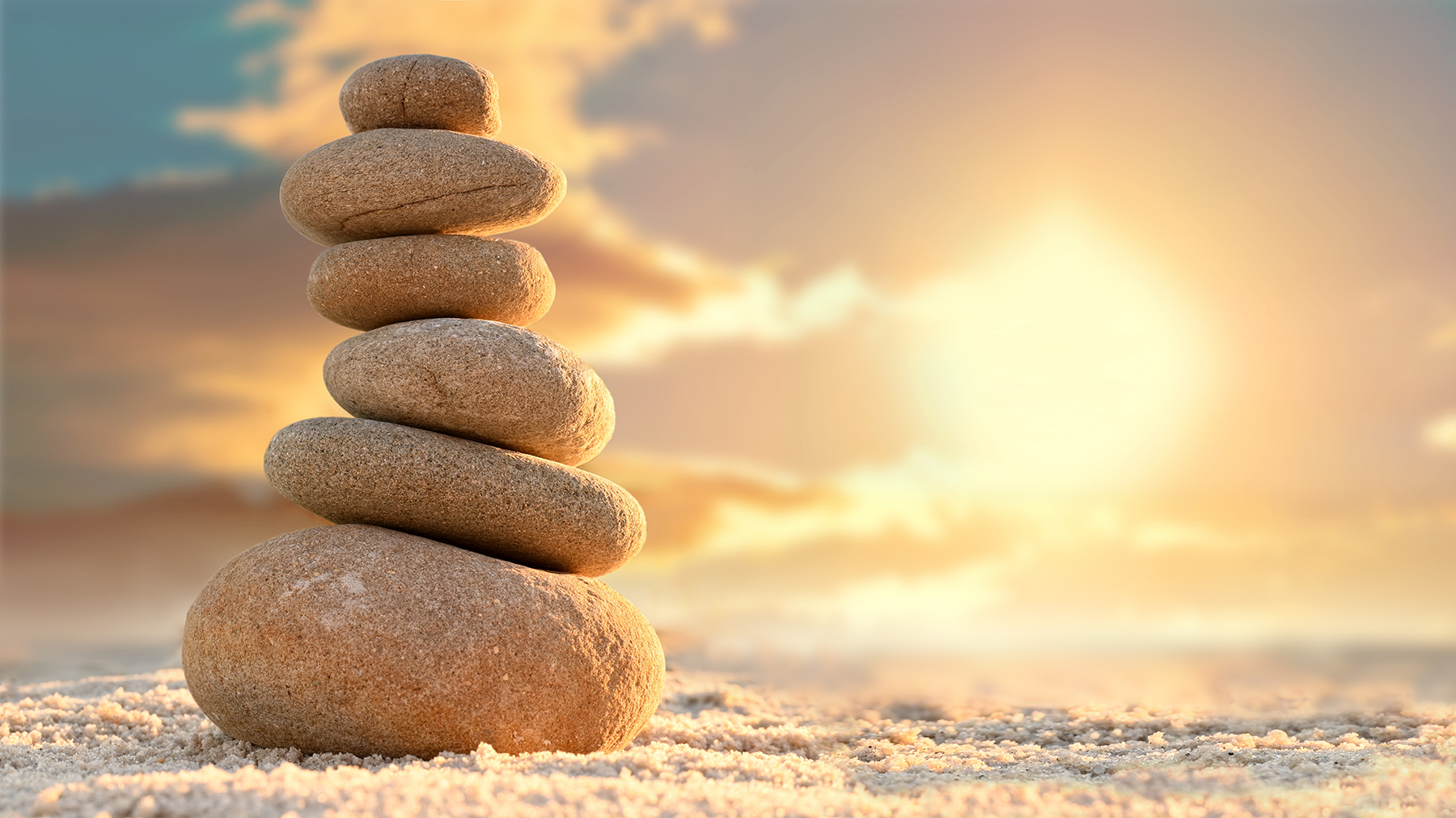 Stone tower. Natural pebble stone on the beach. Balancing body, mind, soul and spirit. Mental health practice.