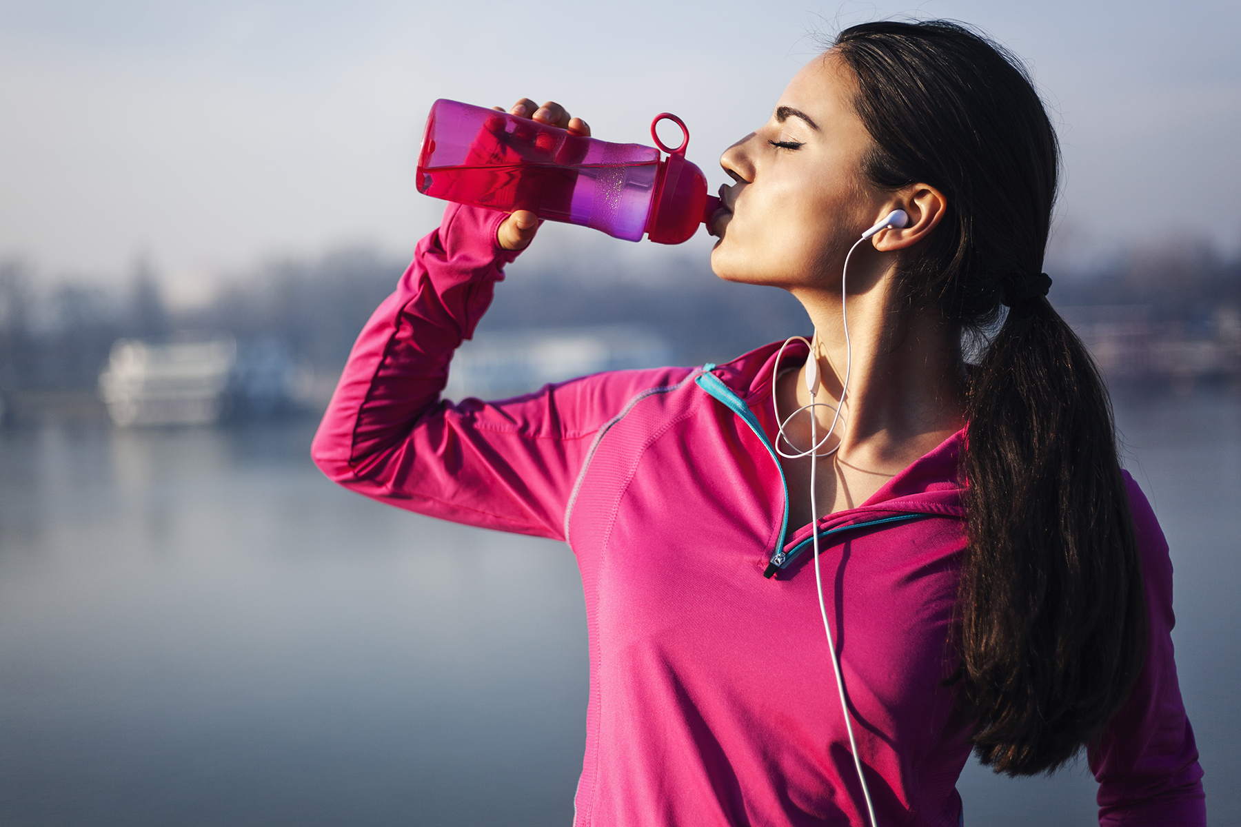 Fitness woman drinking water