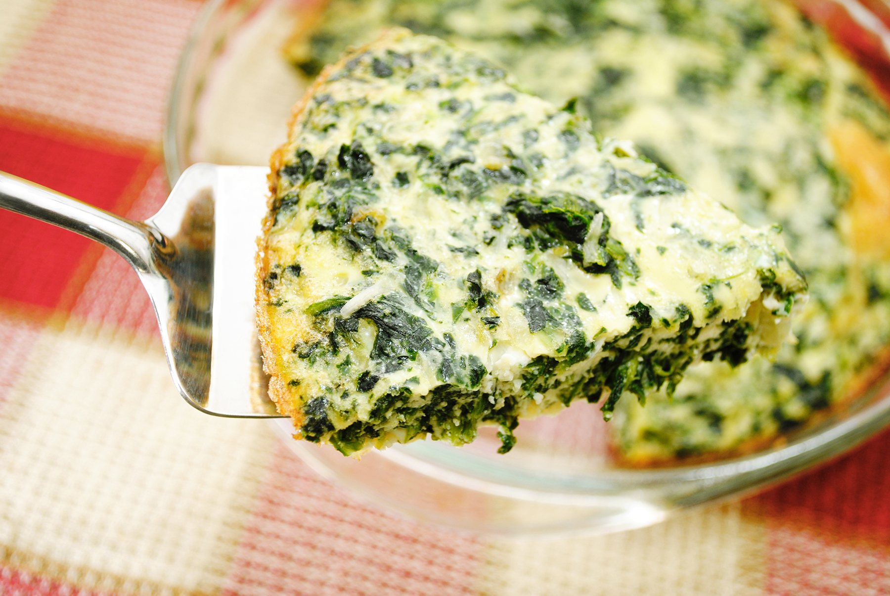 Close Up of a Serving of Spinach Quiche